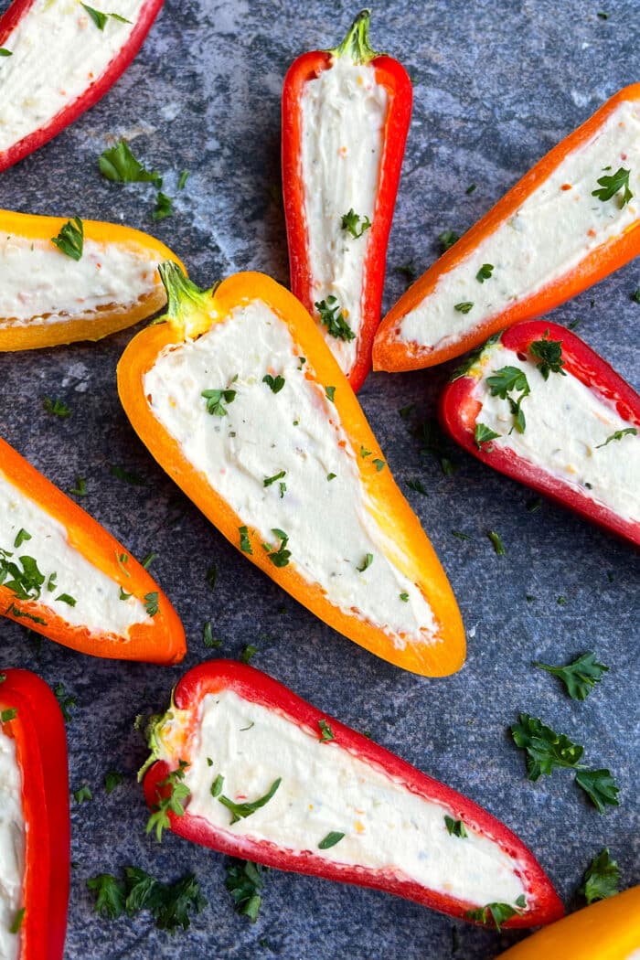 Stuffed mini peppers on gray background.