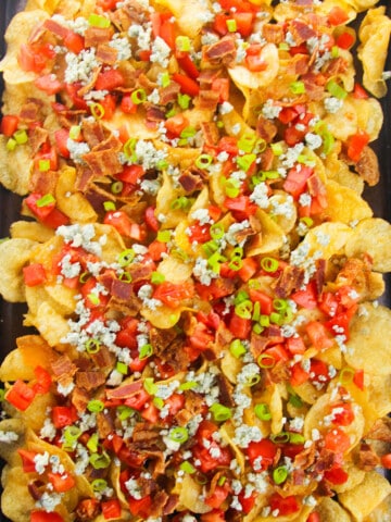 Best easy Irish loaded sheet pan nachos with potato chips and lots of toppings- Overhead shot.
