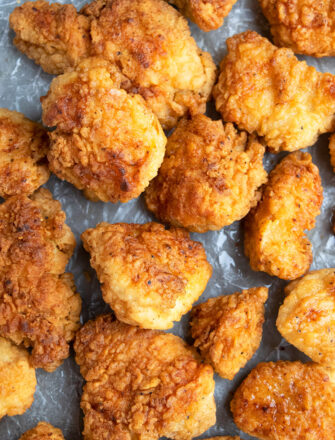 Easy Crispy Homemade Fried Chicken Bites on Paper- Overhead Shot