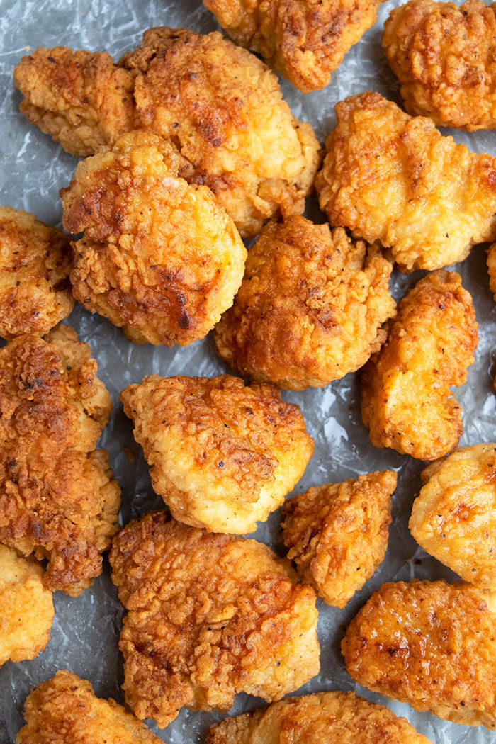 Easy Crispy Fried Chicken Bites on Paper- Overhead Shot