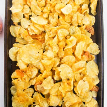 Potato chips spread in a large tray. 