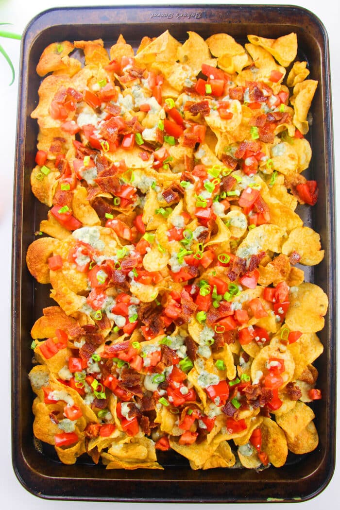 Easy Loaded Sheet Pan Nachos on White Background - Overhead Shot.