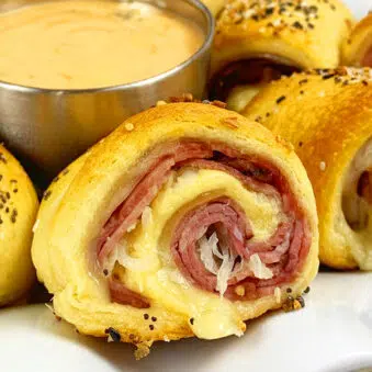 Easy Reuben Rolls Ups (Beef Pinwheel Rolls) with Crescent Dough on White Plate