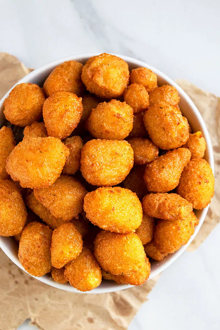 Crispy Breaded Cheese Curds in White Bowl- Overhead Shot