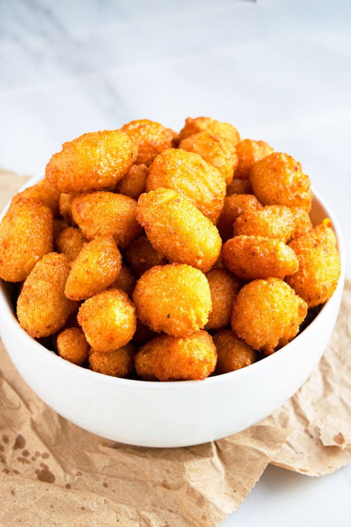 Easy Crispy Fried Cheese Curds in White Bowl.