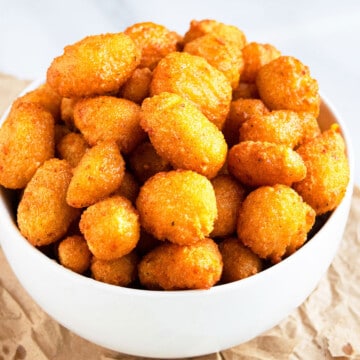Easy One Pot Crispy Breaded Deep Fried Cheese Curds in White Bowl.