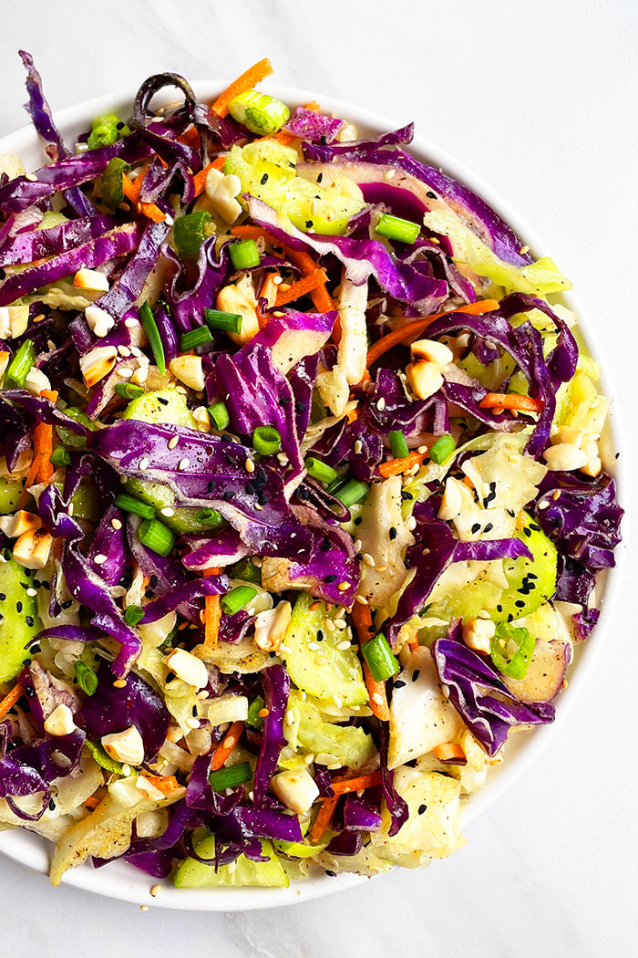 Easy Asian Cabbage Salad in White Dish on White Background