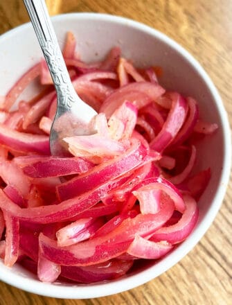 Refrigerator Quick Pickled Red Onions in White Bowl