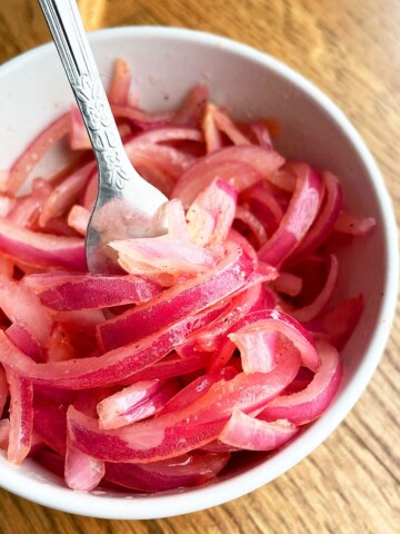 Refrigerator Quick Pickled Red Onions in White Bowl