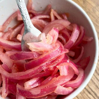 Refrigerator Quick Pickled Red Onions in White Bowl