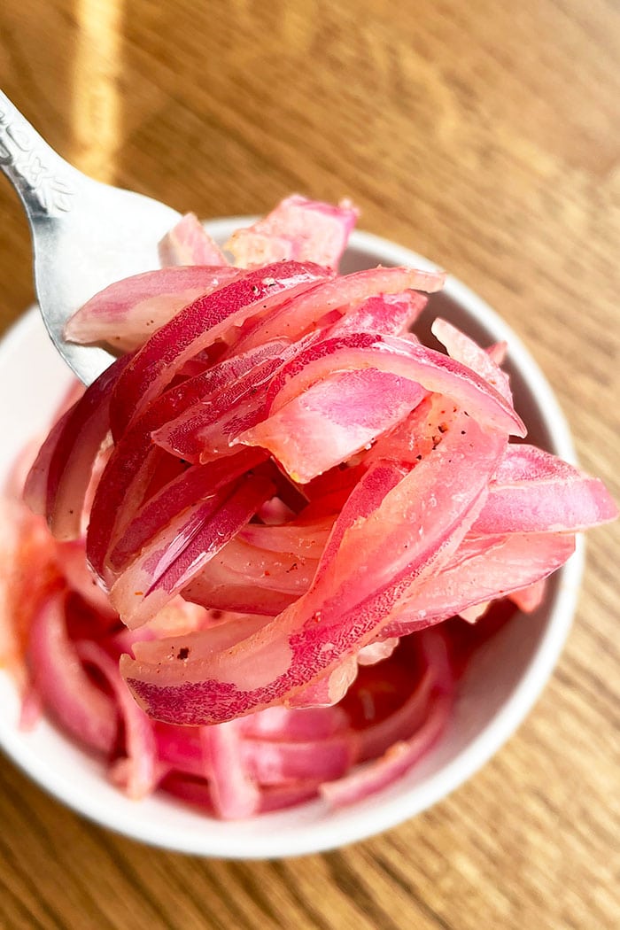 Fork full of Marinated Red Onions- Closeup Shot 