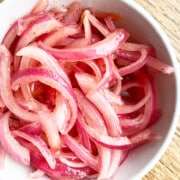 Marinated Refrigerator Quick Pickled Red Onions in White Bowl- Overhead Shot.