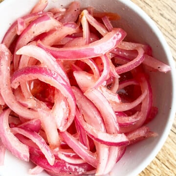 Marinated Refrigerator Quick Pickled Red Onions in White Bowl- Overhead Shot.