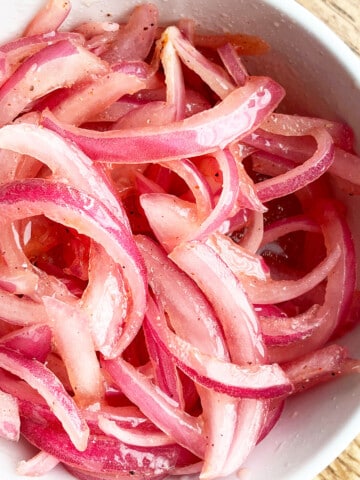 Marinated Refrigerator Quick Pickled Red Onions in White Bowl- Overhead Shot.