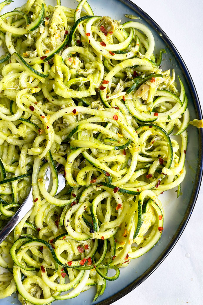 Zucchini Noodles With Pesto on White Dish With Black Rims