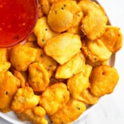 Easy One Pot Crispy Potato Fritters in White Dish (Indian Aloo Pakora)- Overhead Shot.