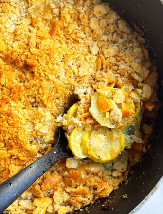 Easy Yellow Squash Casserole With Crispy Ritz Cracker Topping in Black Pot
