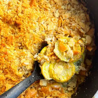 Easy Yellow Squash Casserole With Crispy Ritz Cracker Topping in Black Pot