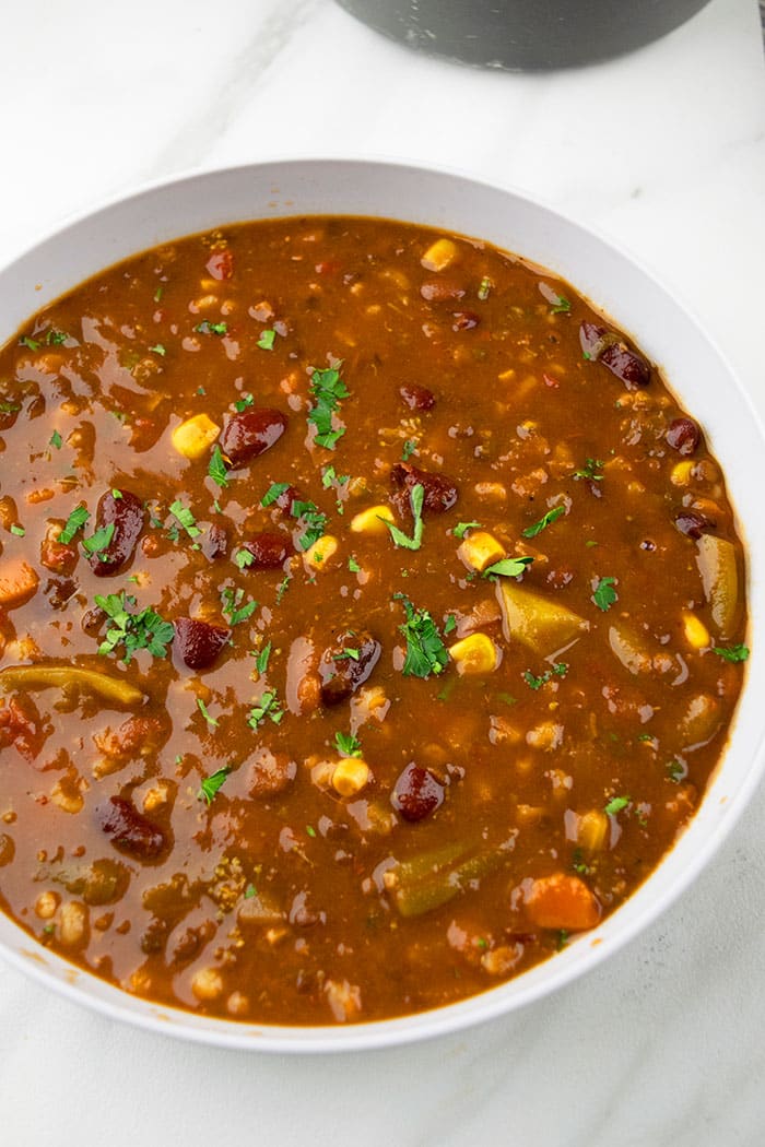 Easy Instant Pot Turkey Chili in Gray Bowl on White Background