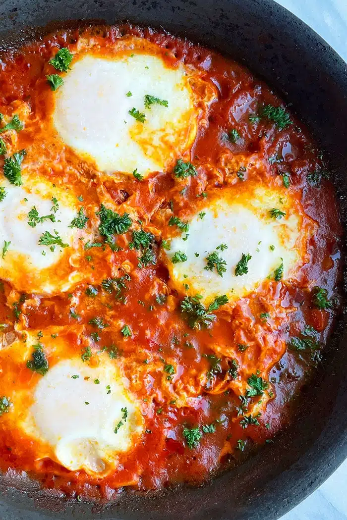 Best Shakshuka Eggs With Feta In Black Pan