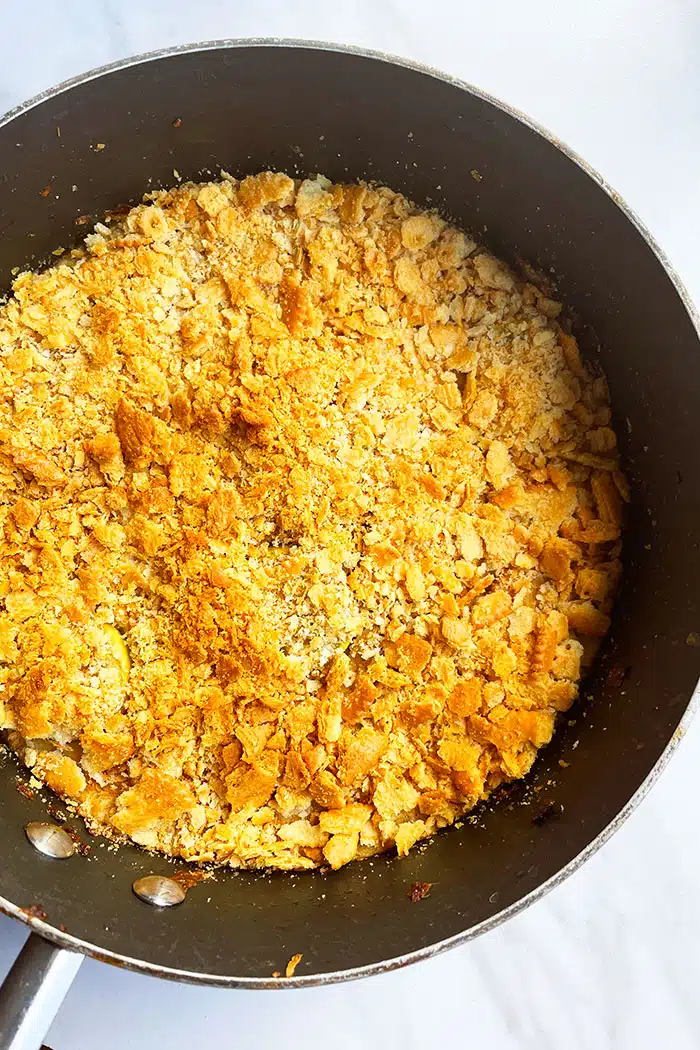 Closeup Shot of Crispy Ritz Cracker Topping in Black Pot