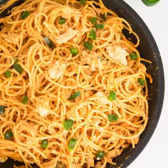 Easy Creamy Buffalo Chicken Pasta on Marble Background.