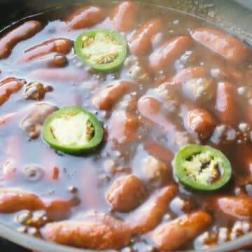 Jalapeno slices added to saucy sausages. 