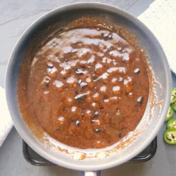 Sauce bubbling in nonstick pan- Overhead shot. 
