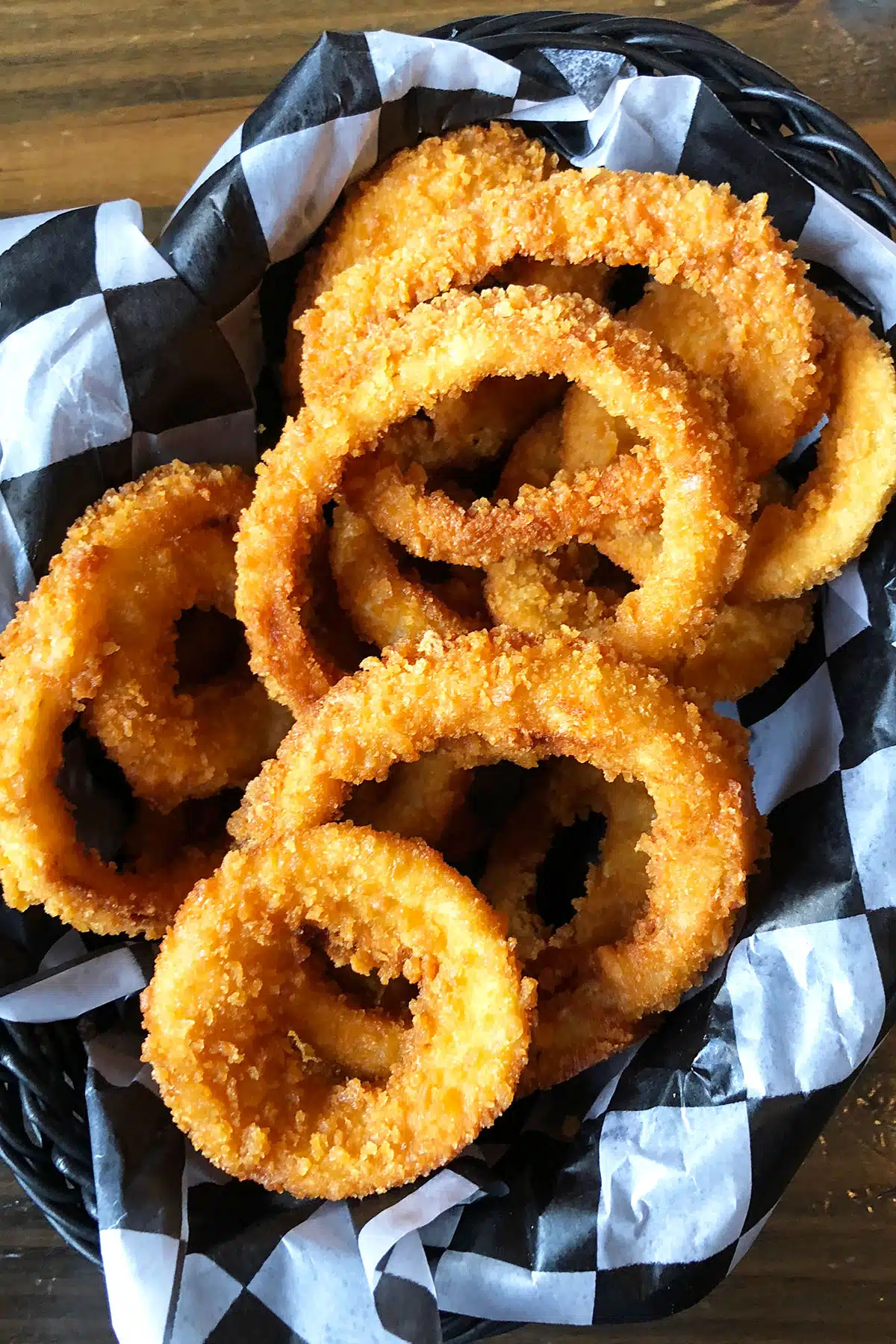 Easy One Pot Crispy Fried Onion Rings in Lined Basket.