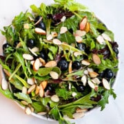 White Dish Full of Easy Blueberry Salad With Blueberry Vinaigrette.