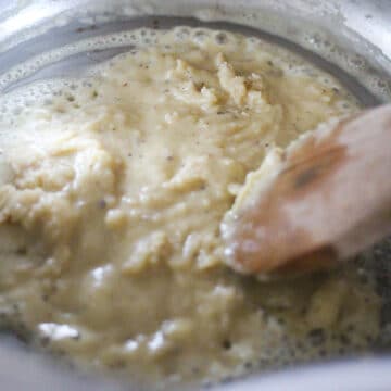 Butter and flour being cooked in large pot. 