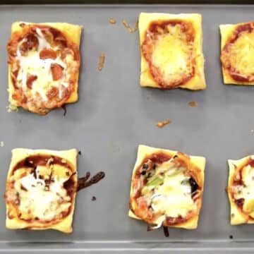 Baked puffs on gray metal tray. 