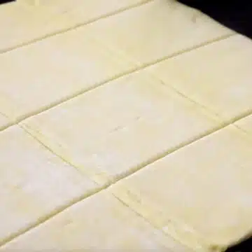 Puff pastry sheet cut into squares. 