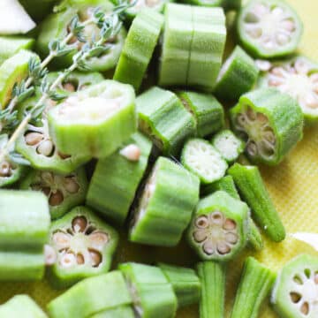 Sliced okra on cutting board. 