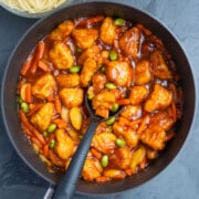 Overhead shot of best easy homemade Chinese sweet and sour chicken in nonstick pot- Overhead shot.