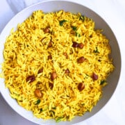 Best easy one pot spicy rice (peanut rice) served in off white bowl on marble background.