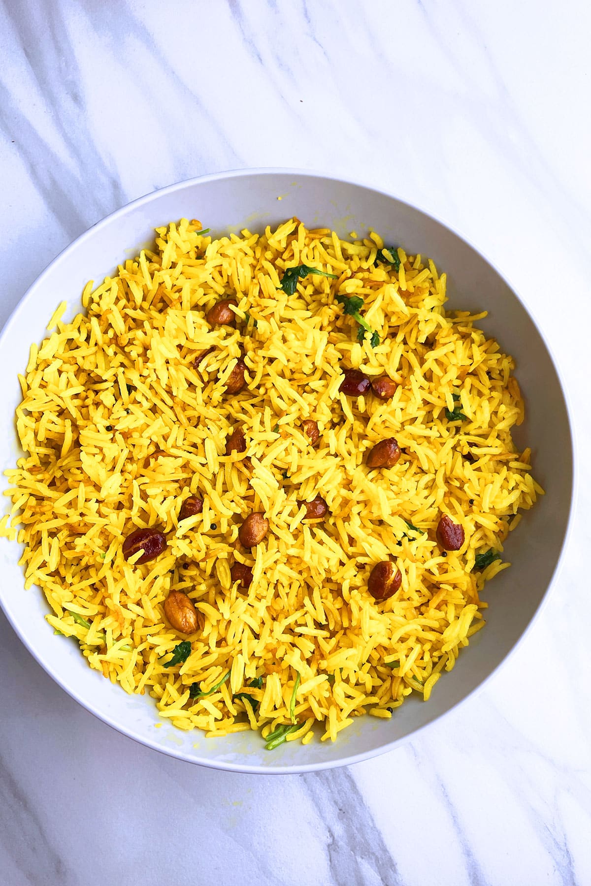Easy one pot spicy rice served in off white bowl- overhead shot. 