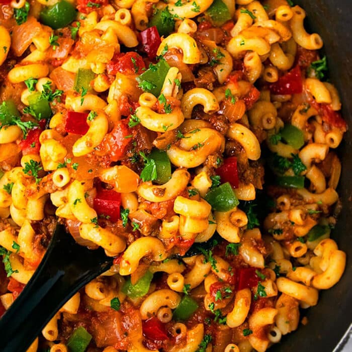 Large spoonful of American goulash- Overhead shot.