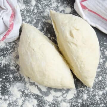 Ball of dough divided into 2 equal portions. 