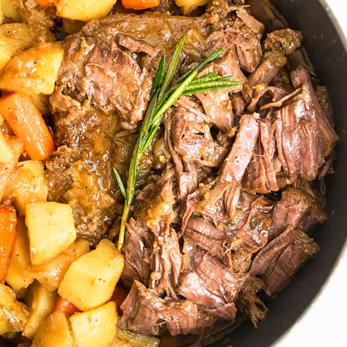 Homemade pot roast that's partially shredded with potatoes and carrots. 